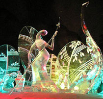“Spring” ice sculpture by Qifeng An and team for World Ice Art Championships in 2006. Lit at night, image of woman in boat and panels representing flora and fauna of spring, abstract.