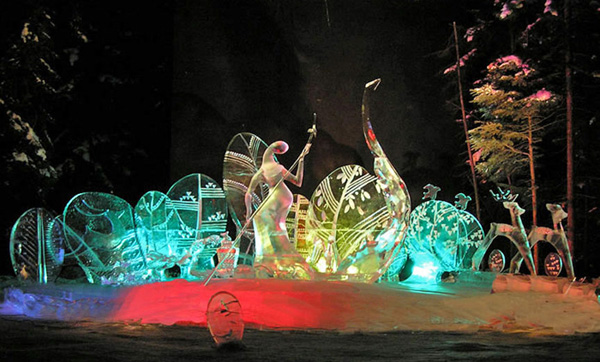 Abstract sculpture named “Spring,” by Qifeng An and team, lit by colored lights.
