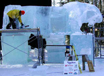 Steve Brice, Heather Brown and their team begin an ice sculpture of a tiger, early in the process. Ice Alaska World Ice Art Championship Event, 2004.