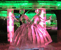 Two ice ballerinas, pink lighting, green lights behind, Harbin China Festival. Artist unknown. Photo by Sourev Day.