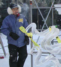 Junichi Nakamura looking over a work in progress, “Earring,” ice sculpture. Ice Alaska Event, 2004. 