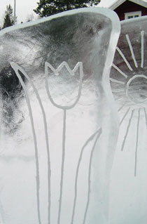 “Kai Tormikoski and Mauno Akhkisalo's sculpture "Four Seasons" 4 ice panels with simple elements of weather carved into them, representing the seasons. Kalajoki, Finland 2004. Here is a detail of a panel with a tulip on it.